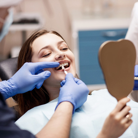 Dentist examining a woman’s teeth 