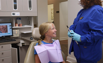 Smiling little girl in dental chair