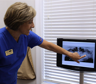 Dentist showing a patient their dental x rays