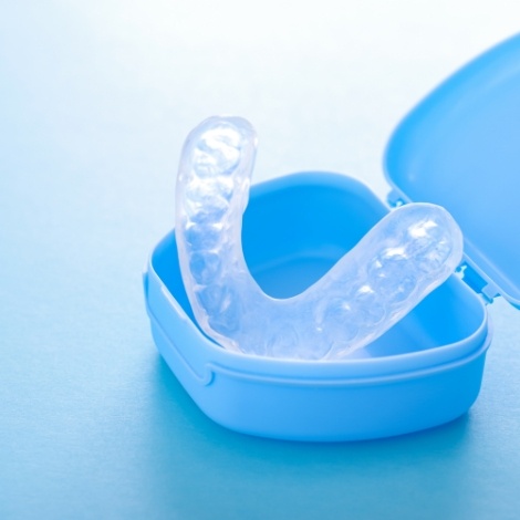 Clear mouthguard in blue carrying case