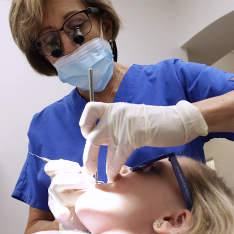 Dentist performing dental exam during visit for preventive dentistry in Fort Mill