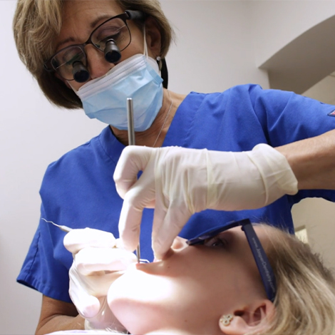Dentist performing dental exam during visit for preventive dentistry in Fort Mill