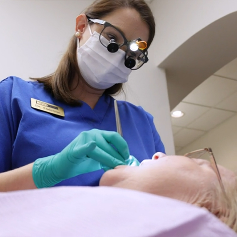 Dentist examining a dental patient before T M J treatment in Fort Mill