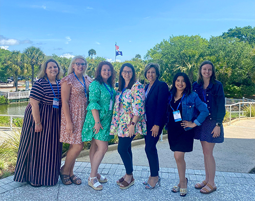 Jasper Dentistry team in Fort Mill posing outdoors in formal clothing