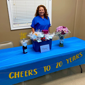 Dental team member at Jasper Dentistry table at community event