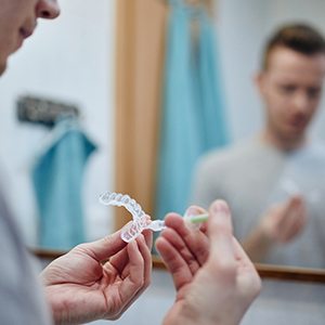 Patient using professional take-home whitening kit